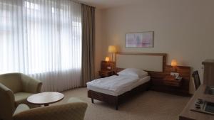 Ein Bett oder Betten in einem Zimmer der Unterkunft Boardinghouse am Wall