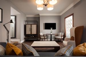a living room with a couch and a table at The Parkgate Hotel in Cardiff