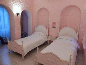 Katil atau katil-katil dalam bilik di Rose Heritage Home