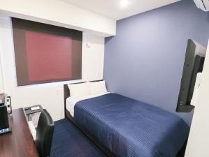 Postel nebo postele na pokoji v ubytování HOTEL LiVEMAX Akihabara Kita + 13 fotografií