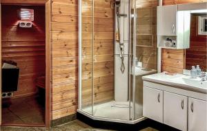 a bathroom with a shower and a sink at Awesome Home In Spangereid With Sauna in Spangereid