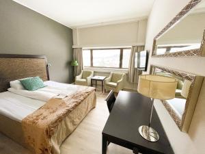 Säng eller sängar i ett rum på Hotell Koselig