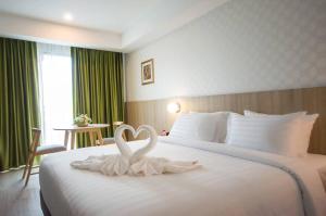 Postel nebo postele na pokoji v ubytování Marsi Hotel @ Bangchak
