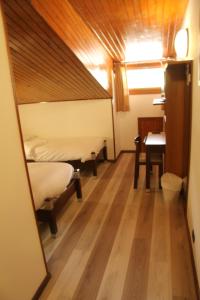 Postel nebo postele na pokoji v ubytování Hotel Davost