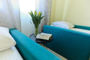 Łóżko lub łóżka w pokoju w obiekcie M&K Apartamenty Rodzinny, Gdańsk - Wyspa Sobieszewska