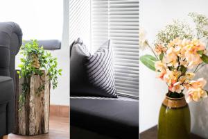 a vase filled with flowers sitting next to a couch at Tiddles in St Ives