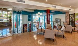 a dining room with chairs and a table in a building at Perla Marina in Nerja