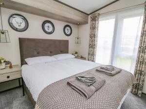 Posteľ alebo postele v izbe v ubytovaní Hares Meadow