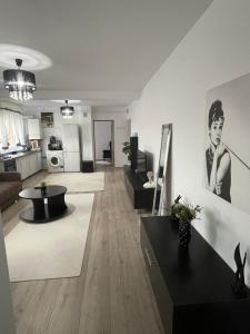 a living room with a couch and a table at Adriana home in Turda