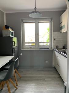 Kuchyňa alebo kuchynka v ubytovaní Marias Apartment