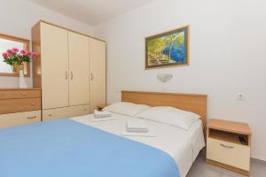 Posteľ alebo postele v izbe v ubytovaní Apartments M&A