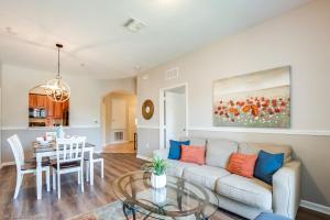 a living room with a couch and a table at Spacious Vista Cay Condo, near Resort Pool in Orlando