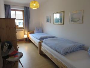 Ein Bett oder Betten in einem Zimmer der Unterkunft Ferienwohnung Birkenflair