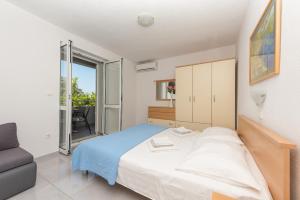Posteľ alebo postele v izbe v ubytovaní Apartments M&A