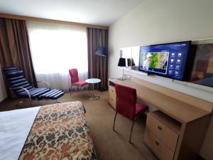 TV a/nebo společenská místnost v ubytování Hotel HP Park Poznań Malta