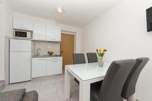 Kuchyňa alebo kuchynka v ubytovaní Apartments M&A