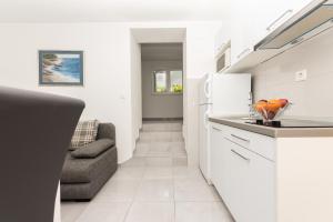 Kuchyňa alebo kuchynka v ubytovaní Apartments M&A