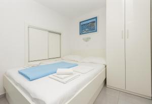 Posteľ alebo postele v izbe v ubytovaní Apartments M&A