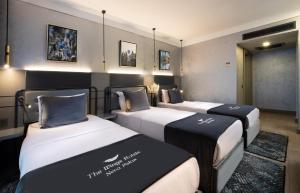 Postel nebo postele na pokoji v ubytování The Wings Hotels Neva Palas