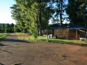 a road leading to a building with a tent at Klein Paradys Parys in Parys +3 photos