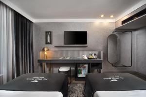 Postel nebo postele na pokoji v ubytování The Wings Hotels Neva Palas