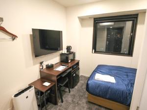 Televiisor ja/või meelelahutuskeskus majutusasutuses HOTEL LiVEMAX Nagoya Kanayama