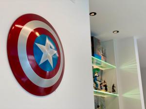 a captain america shield on a wall at Ikiru 18 Private Saltwater Pool Villa, 3 Ensuite BR, Outdoor BBQ, 5 mins to Beach in Pantai Cenang