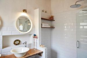 a bathroom with a sink and a mirror and a shower at Casa Urbión-Pinares de Soria in Covaleda +38 photos