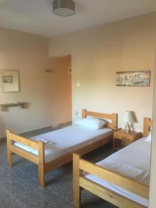 Postel nebo postele na pokoji v ubytování Menis Haus Rooms