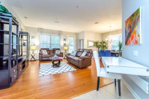 a living room with a couch and a table at Spacious Condo in Vista Cay Resort LUXURY AWAITS in Orlando