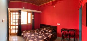 Ένα ή περισσότερα κρεβάτια σε δωμάτιο στο Orchid Homestay