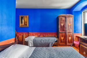 Postel nebo postele na pokoji v ubytování Hotel Portacavana