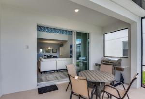 a kitchen and dining room with a table and chairs at Beautiful Home wPrivate Pool & Spa, near WDW in Kissimmee