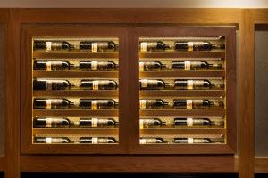 a wooden wine cellar with wine bottles at Prima Park Hotel Jerusalem in Jerusalem