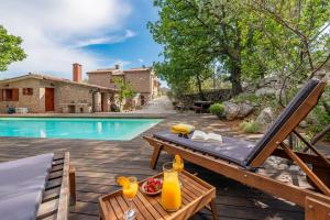 a villa with a swimming pool and a patio at Villa Stone House Magarac in Seline