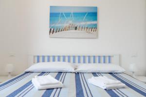 Postel nebo postele na pokoji v ubytování Casa Maiolica