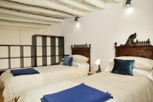 Postel nebo postele na pokoji v ubytování B&B RONCO ZAFFARANA