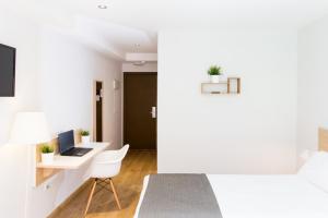 TV a/nebo společenská místnost v ubytování Rooms Ciencias