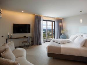 TV a/nebo společenská místnost v ubytování Cayo Exclusive Resort & Spa