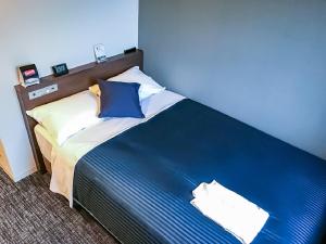 Ліжко або ліжка в номері HOTEL LiVEMAX Nagoya Sakuradoriguchi