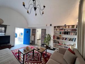 a living room with a couch and a table at OLIVIA Guest House (Eya & Abbes) in Sidi Bou Saïd