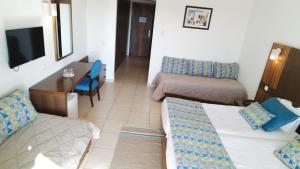 Postel nebo postele na pokoji v ubytování El Mehdi Beach Resort ex Primasol El Mehdi