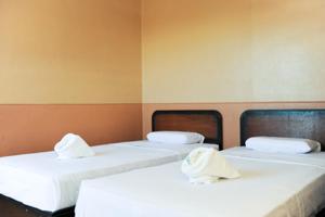 Postel nebo postele na pokoji v ubytování GV Hotel - Ipil