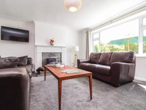a living room with a couch and a coffee table at Moorstone in Penryn