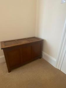 a corner of a room with a wooden desk at Landguard Lodge Guest House in Southampton