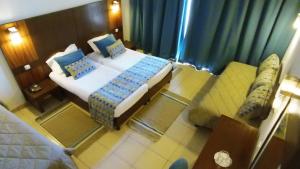 Postel nebo postele na pokoji v ubytování El Mehdi Beach Resort ex Primasol El Mehdi