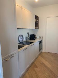 A kitchen or kitchenette at RELAIS NANNI HOME