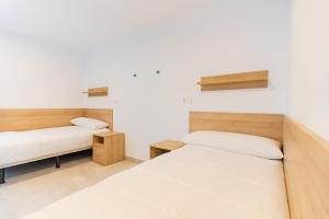 Posteľ alebo postele v izbe v ubytovaní micampus Avenida del Puerto - Residencia de Estudiantes