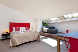 A bed or beds in a room at Lo Speziale - Corbezzolo