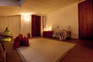 A bed or beds in a room at Lo Speziale - Corbezzolo